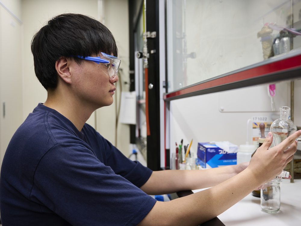 A student examining glassware