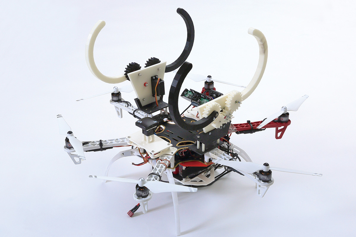 棒状の物体を把持し作業する飛行ロボット